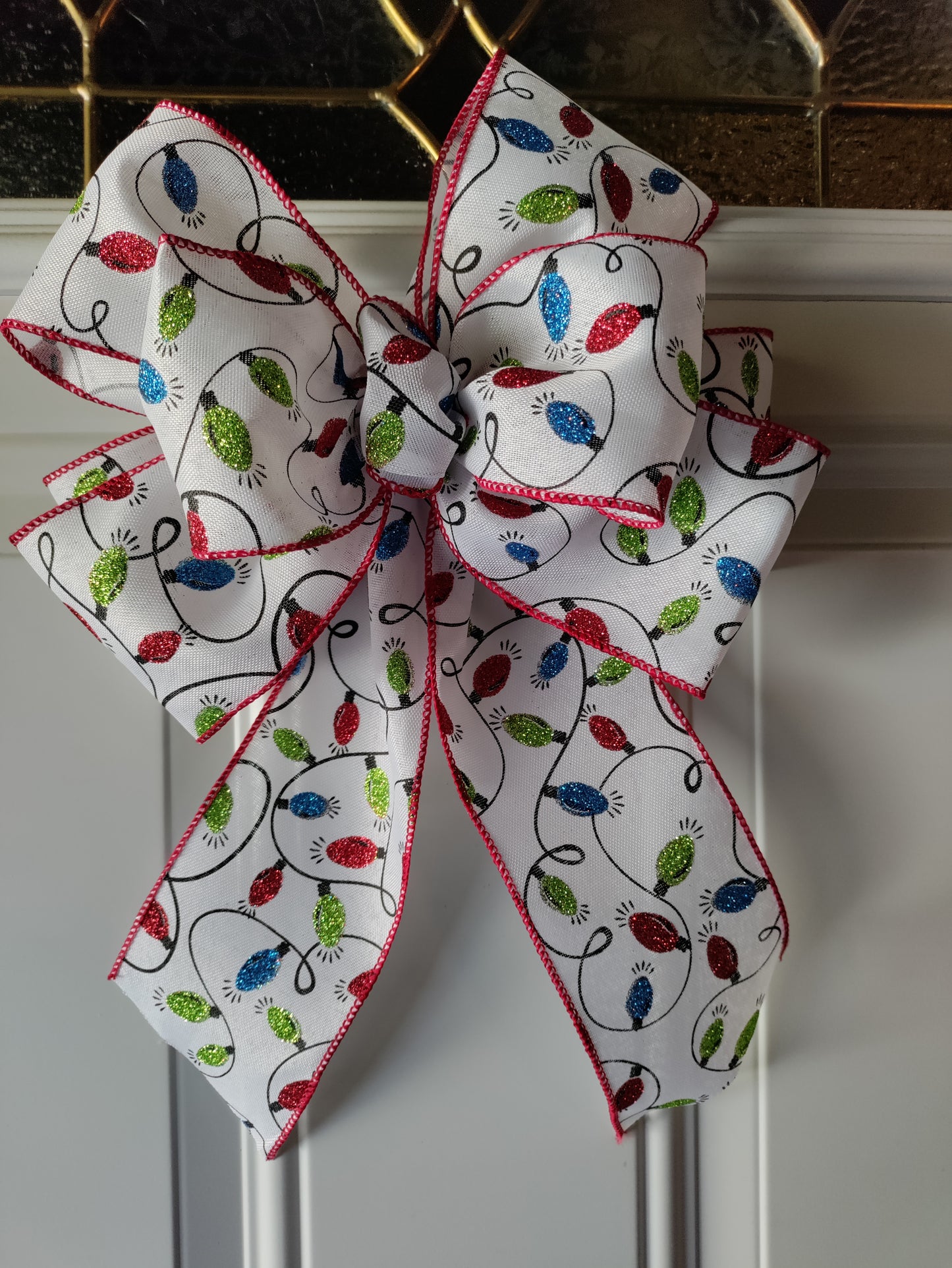 White Bow with Green, Red, and Blue Light Bulbs