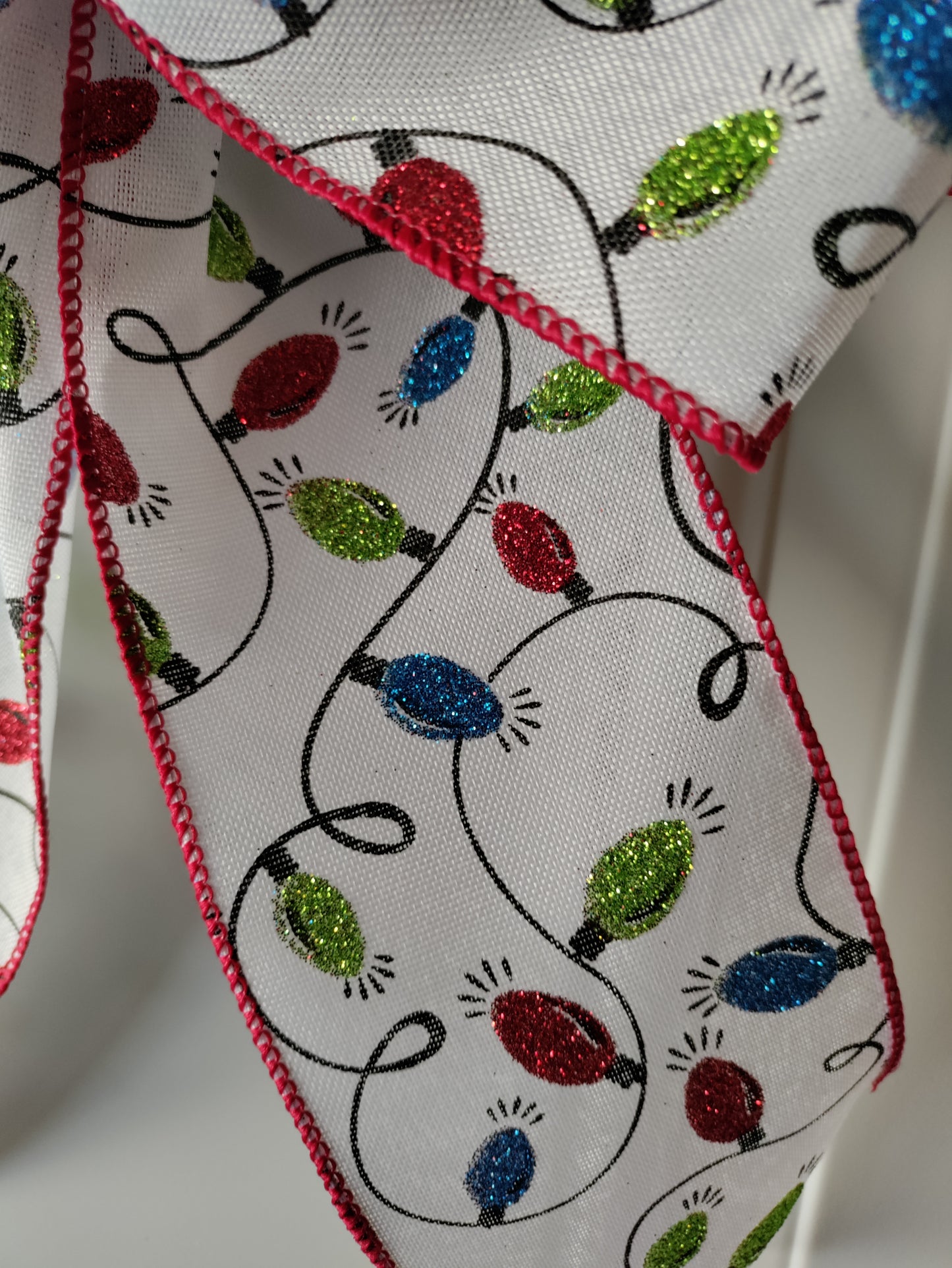 White Bow with Green, Red, and Blue Light Bulbs