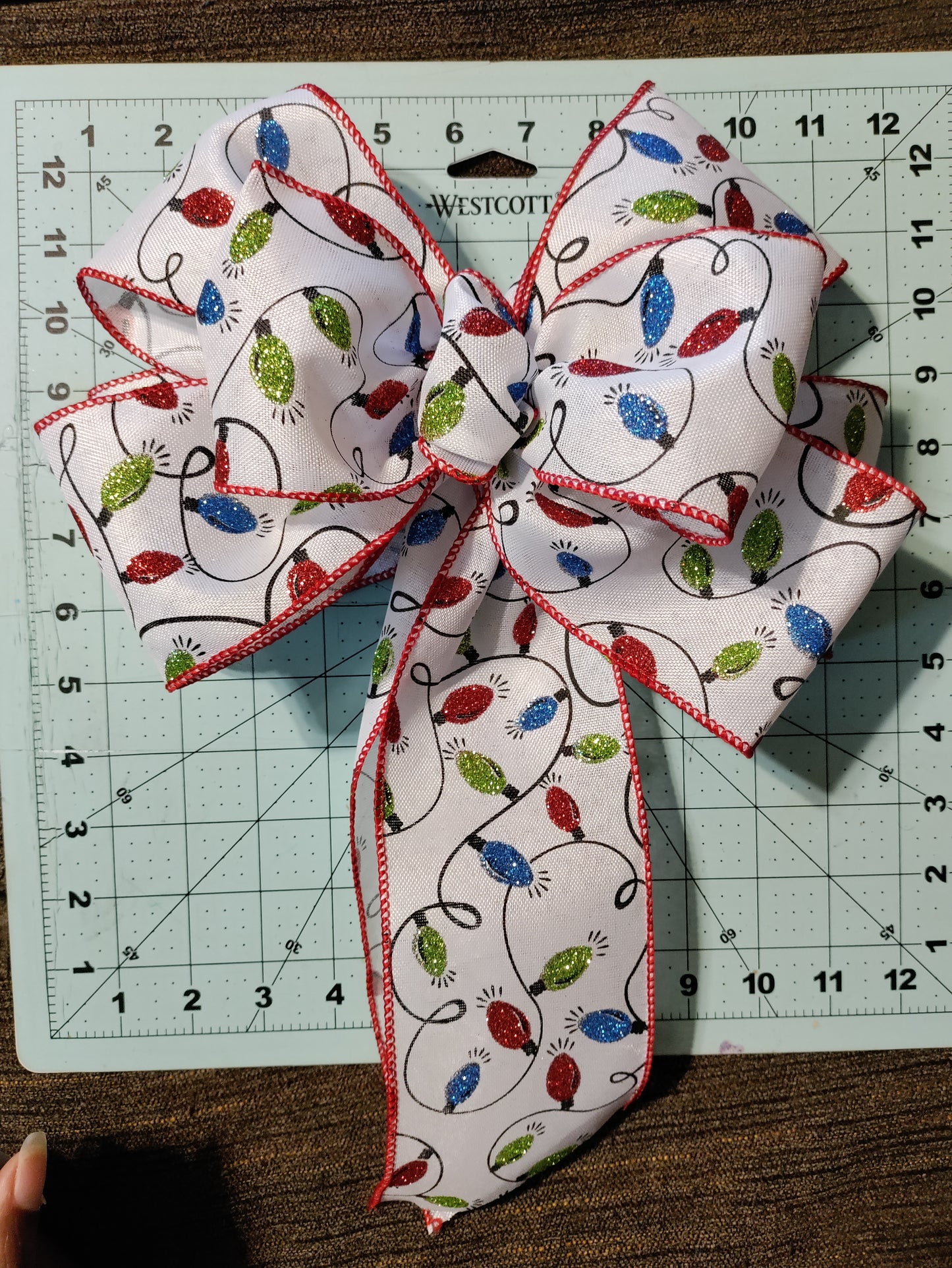 White Bow with Green, Red, and Blue Light Bulbs