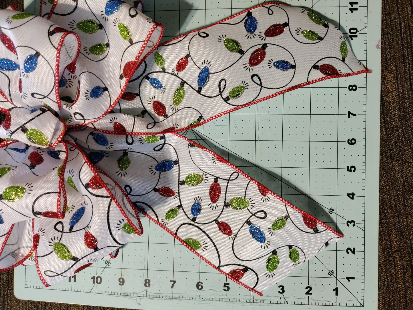 White Bow with Green, Red, and Blue Light Bulbs