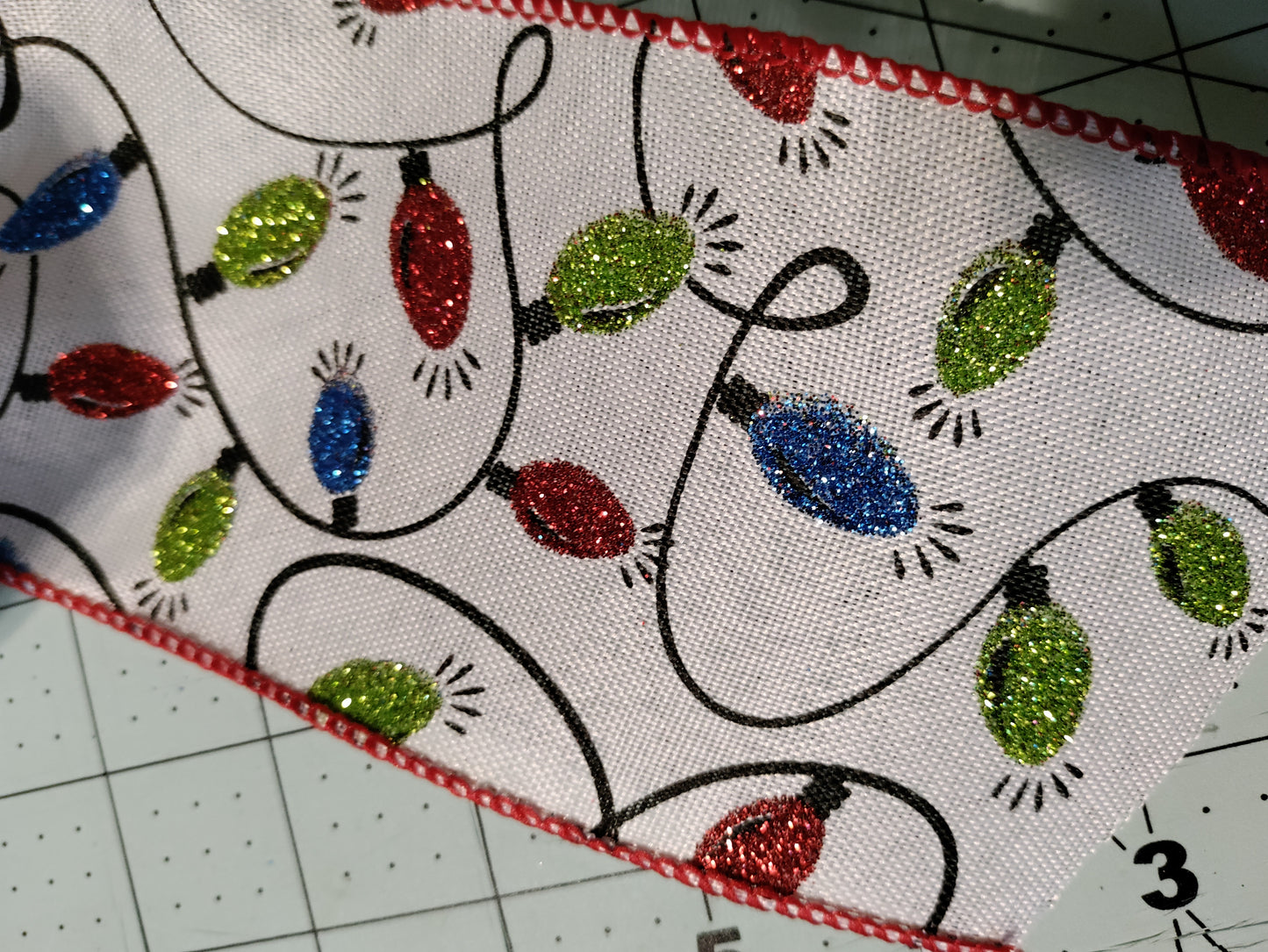 White Bow with Green, Red, and Blue Light Bulbs